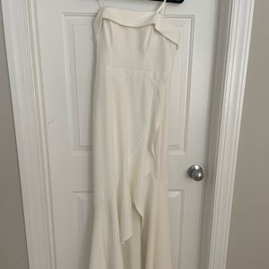 Long white dress, new with tags, never worn; fitted style with ruffle bottom